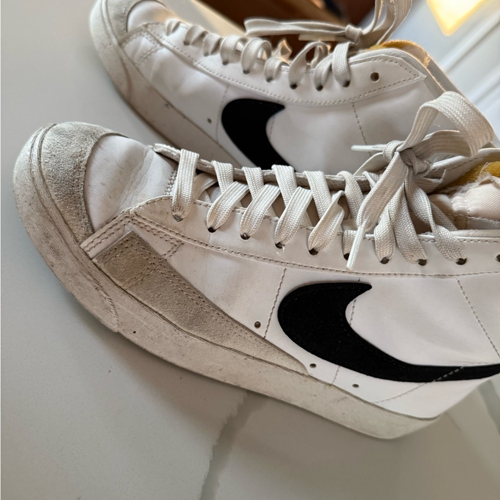 Nike White High-Top Sneakers with Black Swoosh